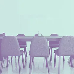 WestExec-heroimage2-1080×1080 Chairs around a table